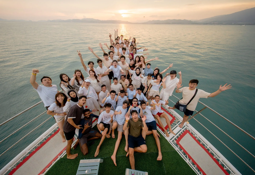 The Axrail team on a boat at sunset, team retreat